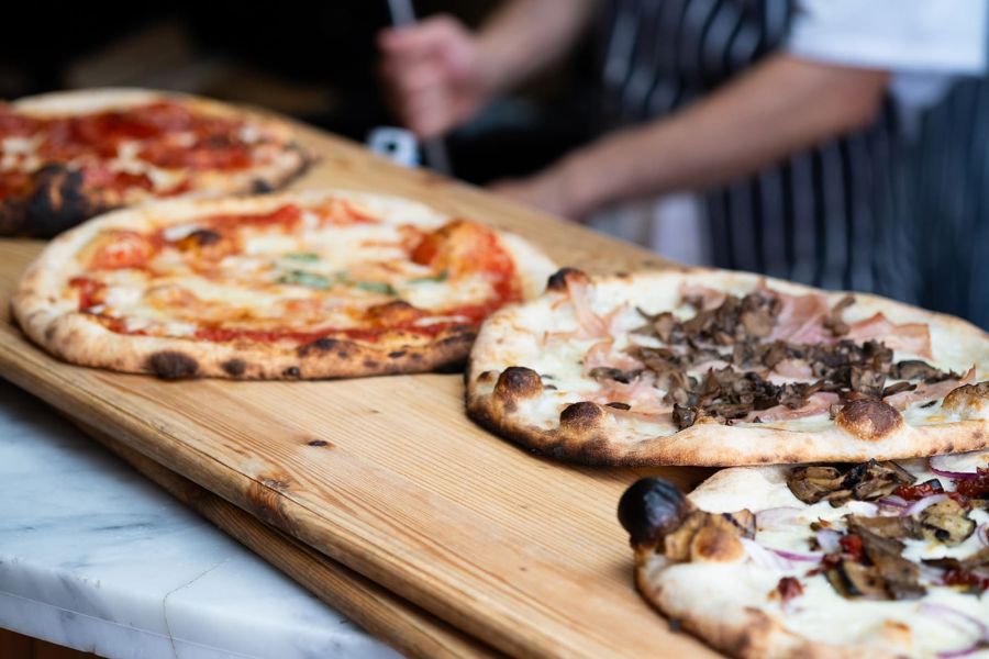 A photo of pizza's in NoLIta